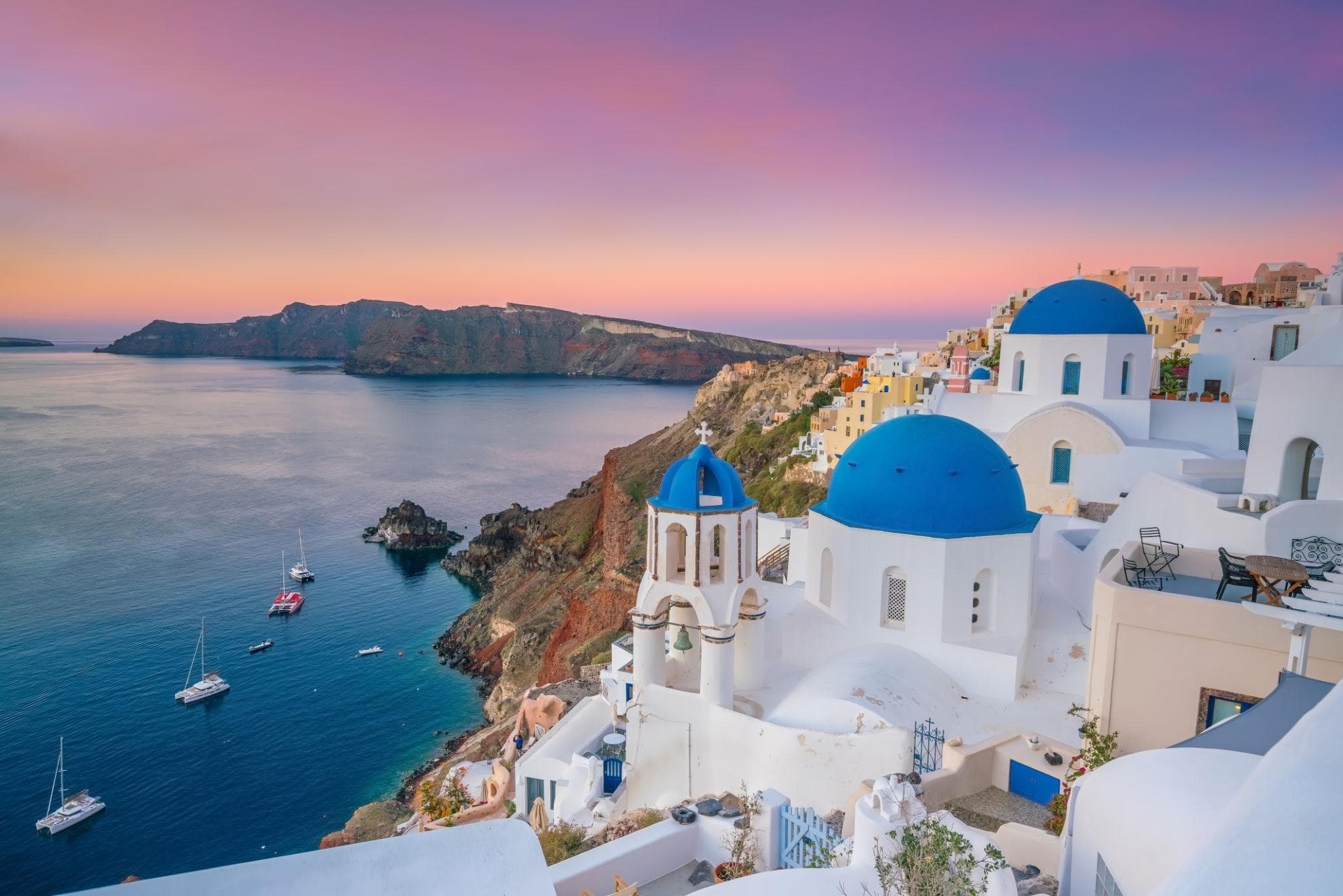 Blue-domed churches above the caldera in Santorini